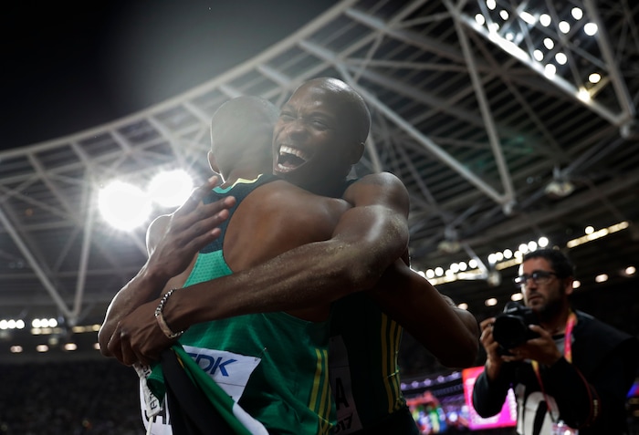 South Africa's gold medal winner Luvo Manyonga, right, is congratulated by his teammate South Africa's Ruswahl Samaai after the men's long jump final during the World Athletics Championships in London Saturday, Aug. 5, 2017. (AP Photo/Matthias Schrader)