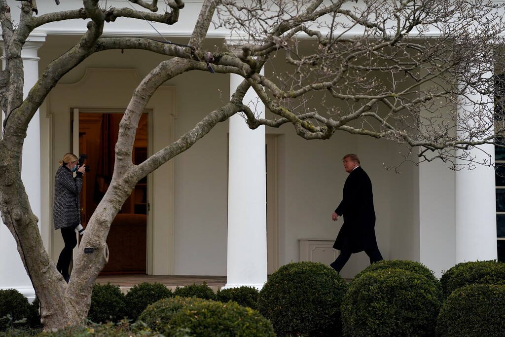 (Evan Vucci | AP photo)
President Donald Trump walks to the White House, Dec. 31, in Washington.