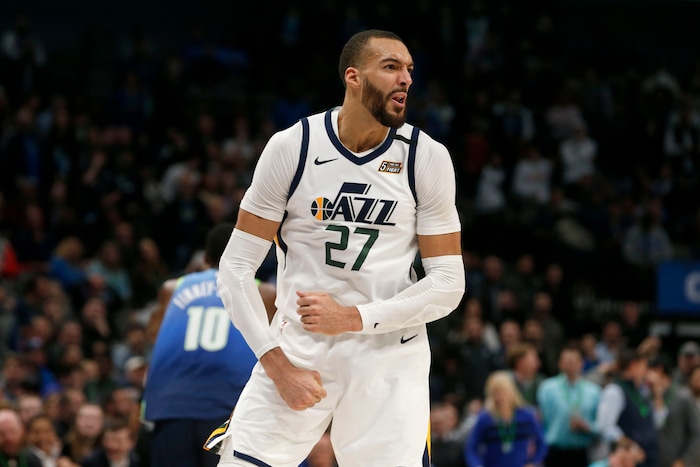 Utah Jazz center Rudy Gobert (27) celebrates a dunk against the Dallas Mavericks during the second half an NBA basketball game in Dallas, Monday, Feb. 10, 2020. (AP Photo/Michael Ainsworth)