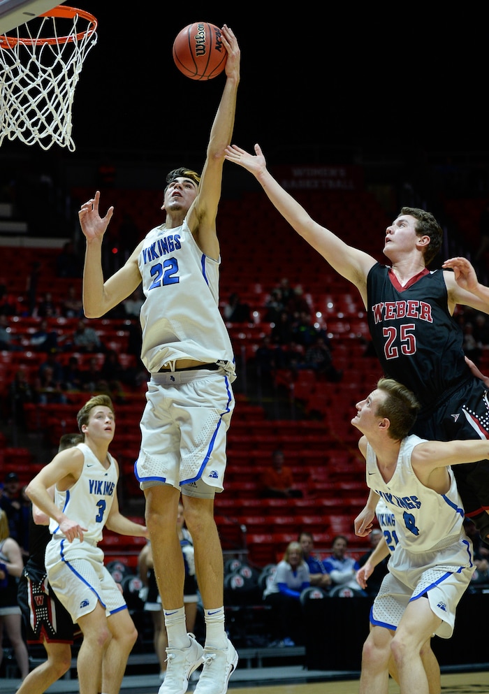 (Francisco Kjolseth  |  The Salt Lake Tribune)  Weber vs Pleasant Grove, 6A State high school basketball tournament at the Huntsman Center in Salt Lake City, Thursday March 1, 2018. Pleasant Grove's Matthew Van Komen (22) places one in over Weber. 
