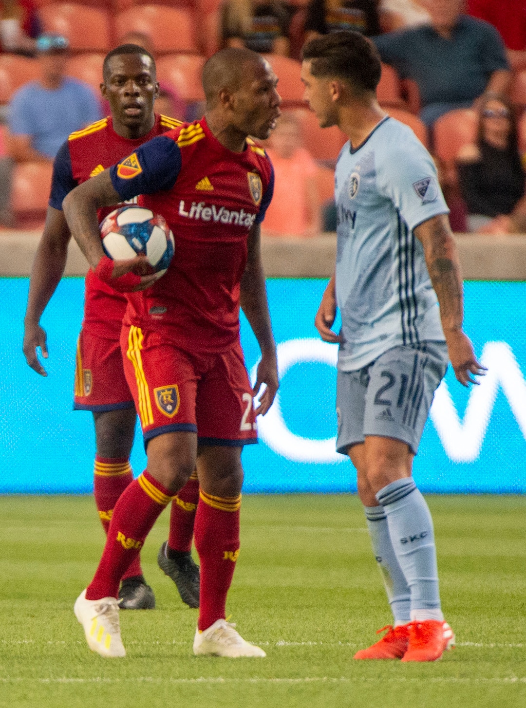 (Rick Egan  |  The Salt Lake Tribune)  Real Salt Lake midfielder Everton Luiz (25) talks to Sporting Kansas City midfielder Felipe Gutierrez (21) at midfield,in MLS action  between Real Salt Lake and Sporting Kansas City, in Sandy, Saturday, June 29, 2019.
