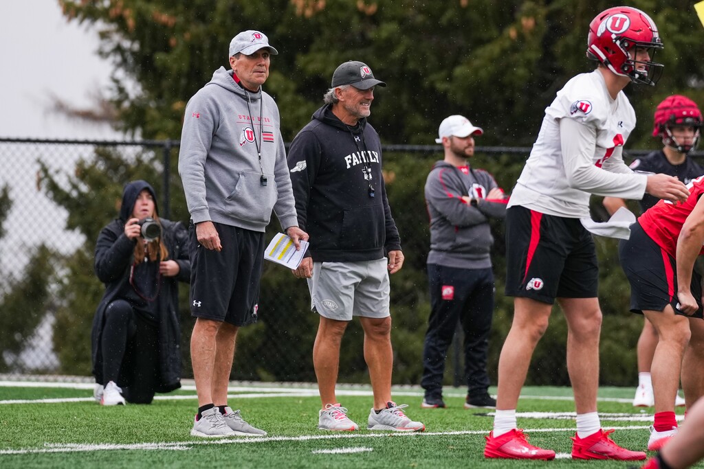 (Eli Rehmer | Utah Athletics) Offensive coordinator Andy Ludwig, left, and head coach Kyle Whittingham, center, observe Utah football practice Tuesday, March 12, 2024.