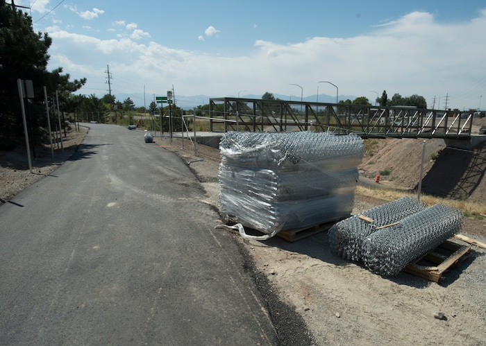 (Rick Egan | The Salt Lake Tribune) Chain-link fence waits to line the sides of a new segment of Parley's Trail in Salt Lake City on Wednesday, Aug. 30, 2017.