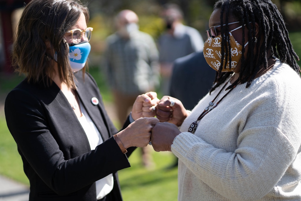 (Francisco Kjolseth | The Salt Lake Tribune) Salt Lake City Mayor Erin Mendenhall, left, and Darlene McDonald bump fists as the Salt Lake City Racial and Equity in Policing Commission holds a press conference at the International Peace Gardens in Salt Lake City on Tuesday, April 20, 2021, following the guilty verdict on all three counts in the murder trial of former Minneapolis police Officer Derek Chauvin in the death of George Floyd.