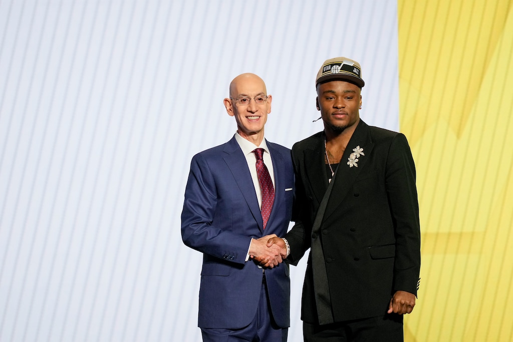 (Julia Nikhinson | AP) Isaiah Collier, right, poses for a photo with NBA commissioner Adam Silver after being selected 29th by the Utah Jazz during the first round of the NBA basketball draft, Wednesday, June 26, 2024, in New York.