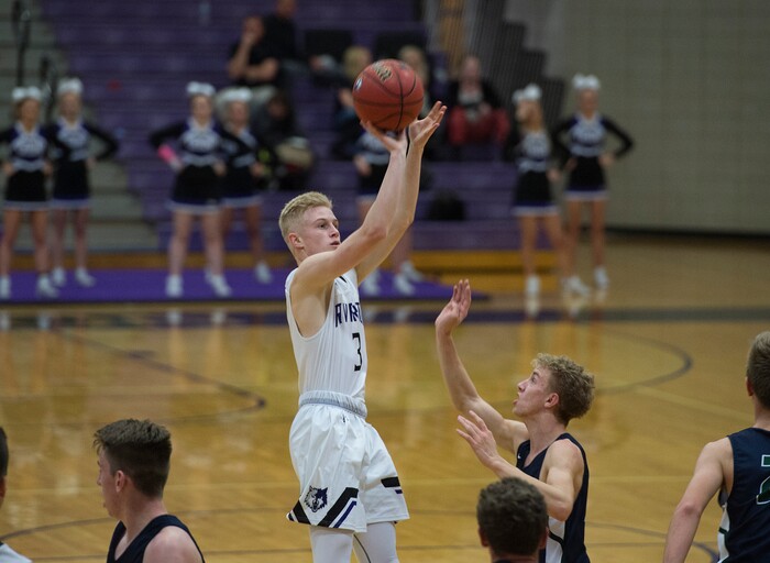 Scott Sommerdorf | The Salt Lake TribuneRiverton's Ben Neilson goes up for a made 3-pointer during first half play. Copper Hills defeated Riverton 54-50, Friday, February, 2, 2018. 