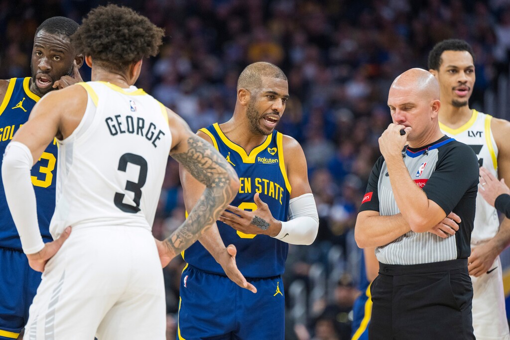 Golden State Warriors guard Chris Paul (3) argues with a referee as Warriors forward Draymond Green (23) and Utah Jazz guard Keyonte George (3) listen during the second half of an NBA basketball game, Sunday, April 7, 2024, in San Francisco. (AP Photo/Nic Coury)