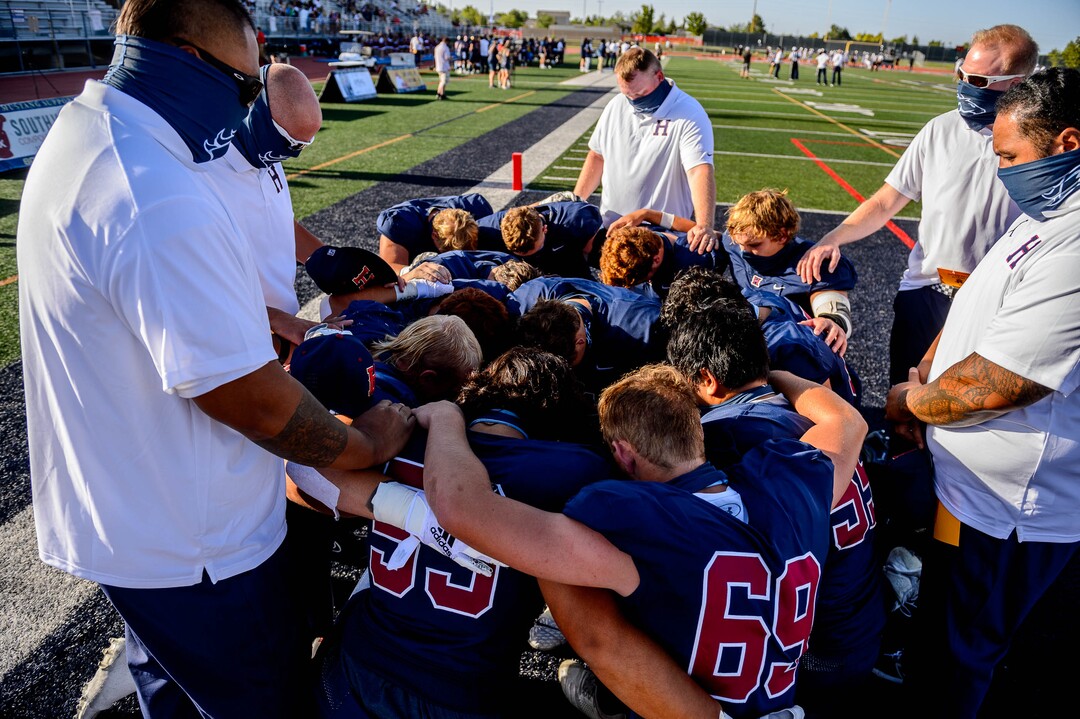 (Trent Nelson  |  The Salt Lake Tribune) Herriman players huddle up before facing Davis, high school football, in Herriman on Thursday, Aug. 13, 2020.
