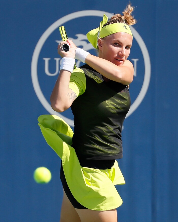 Svetlana Kuznetsova, of Russia, returns to Garbine Muguruza, of Spain, at the Western & Southern Open tennis tournament, Friday, Aug. 18, 2017, in Mason, Ohio. (AP Photo/John Minchillo)