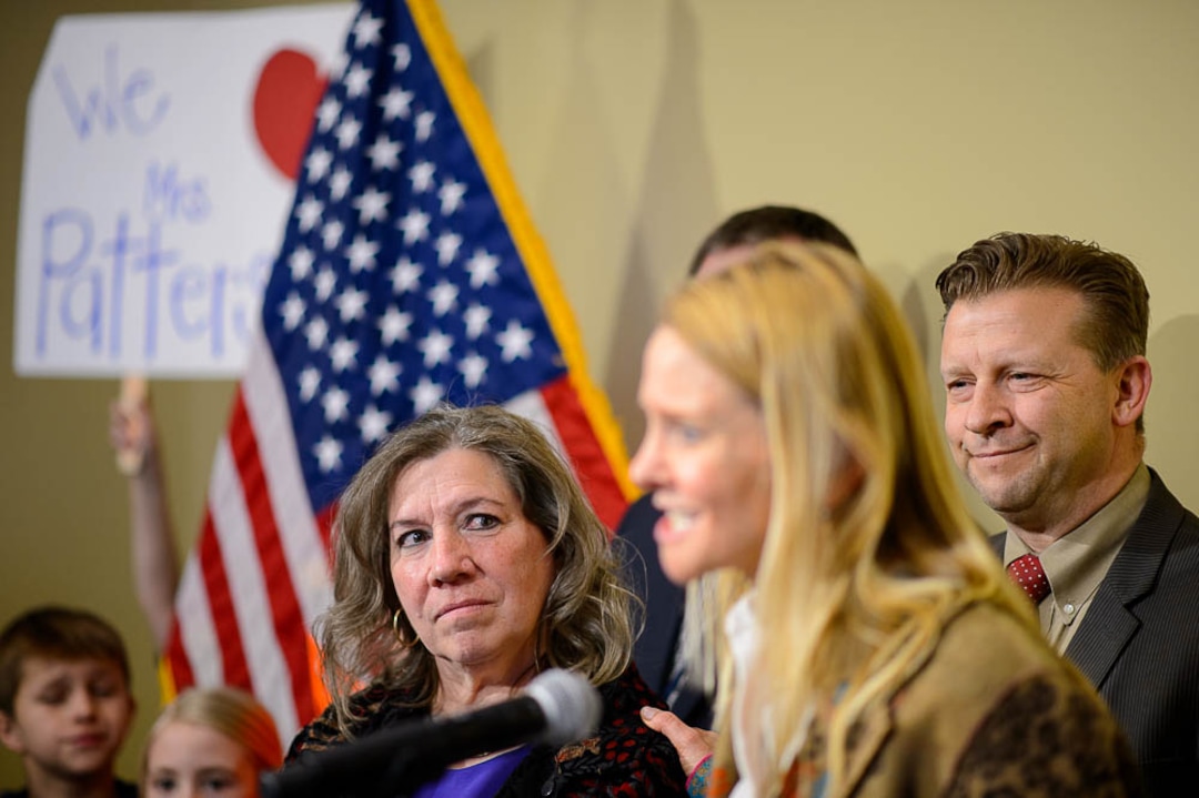(Trent Nelson | The Salt Lake Tribune)  Valley View Elementary School teacher Moana Patterson listens as Tiffany Ivens-Spence speaks at a news conference by parents and students to show support for Patterson, in Salt Lake City on Monday March 11, 2019. Sen. Todd Weiler, R-Woods Cross, at right. Ivens-Spence is the parent of a student at the school.