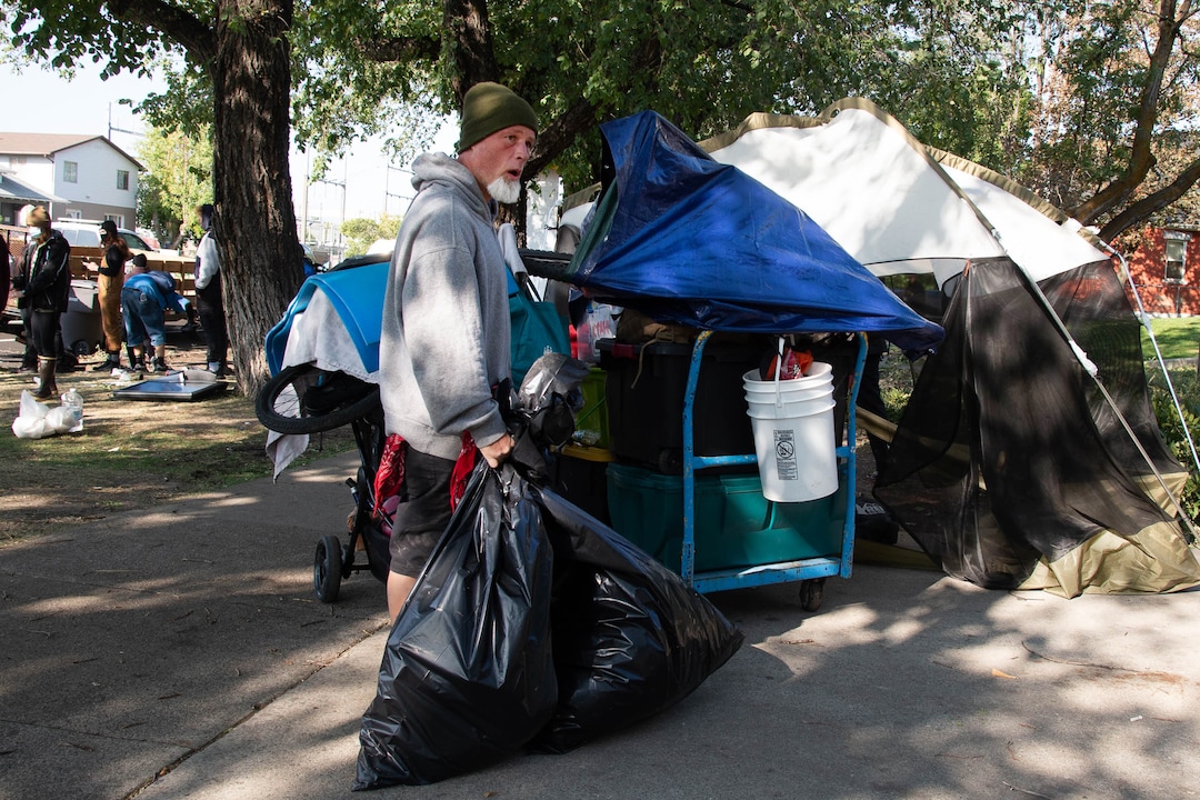 (Francisco Kjolseth  |  The Salt Lake Tribune) Richard Ryan packs up his belongings as the Salt Lake County Health Department forces a clean up of homeless camps at Taufer Park in Salt Lake City on Thursday, Sept. 10, 2020.