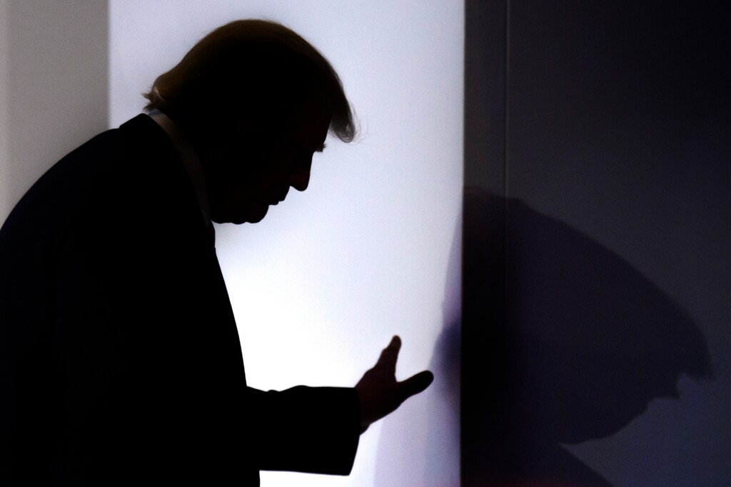 U.S. President Donald  Trump leaves the stage after addressing a plenary session  on the last day of the annual meeting of the World Economic Forum, WEF, in Davos, Switzerland, Friday, Jan. 26, 2018. (Laurent Gillieron/Keystone via AP)