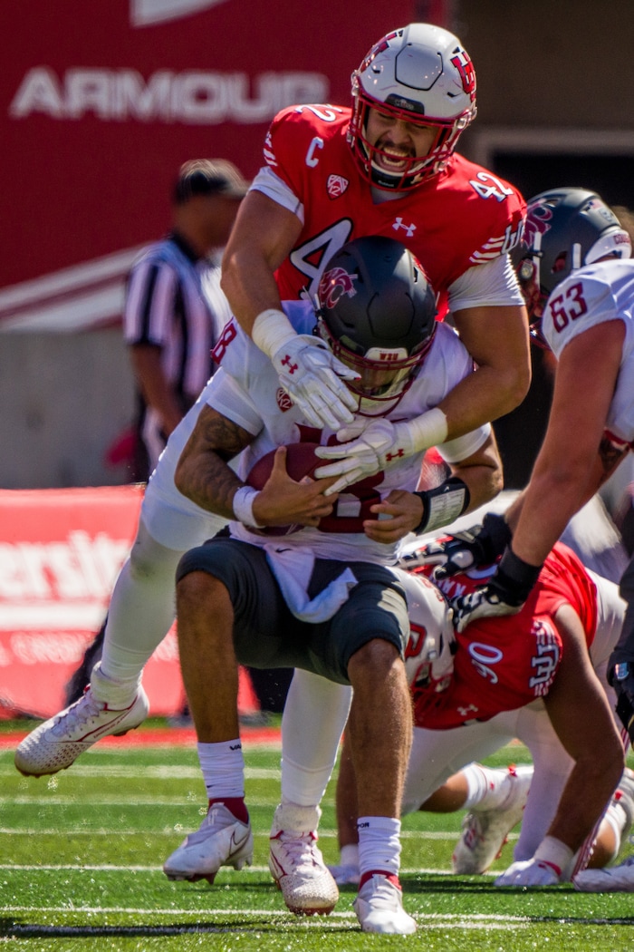 (Trent Nelson  |  The Salt Lake Tribune) Utah Utes defensive end Mika Tafua (42) sacks Washington State Cougars quarterback Jarrett Guarantano (18) as the University of Utah hosts Washington State, NCAA football in Salt Lake City on Saturday, Sept. 25, 2021.