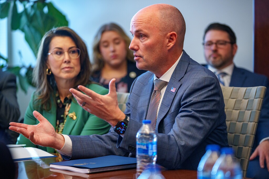 (Trent Nelson  |  The Salt Lake Tribune) Gov. Spencer Cox speaks with the Editorial Board at The Salt Lake Tribune on Wednesday, Dec. 4, 2024. At left is Lt. Gov. Deidre Henderson.