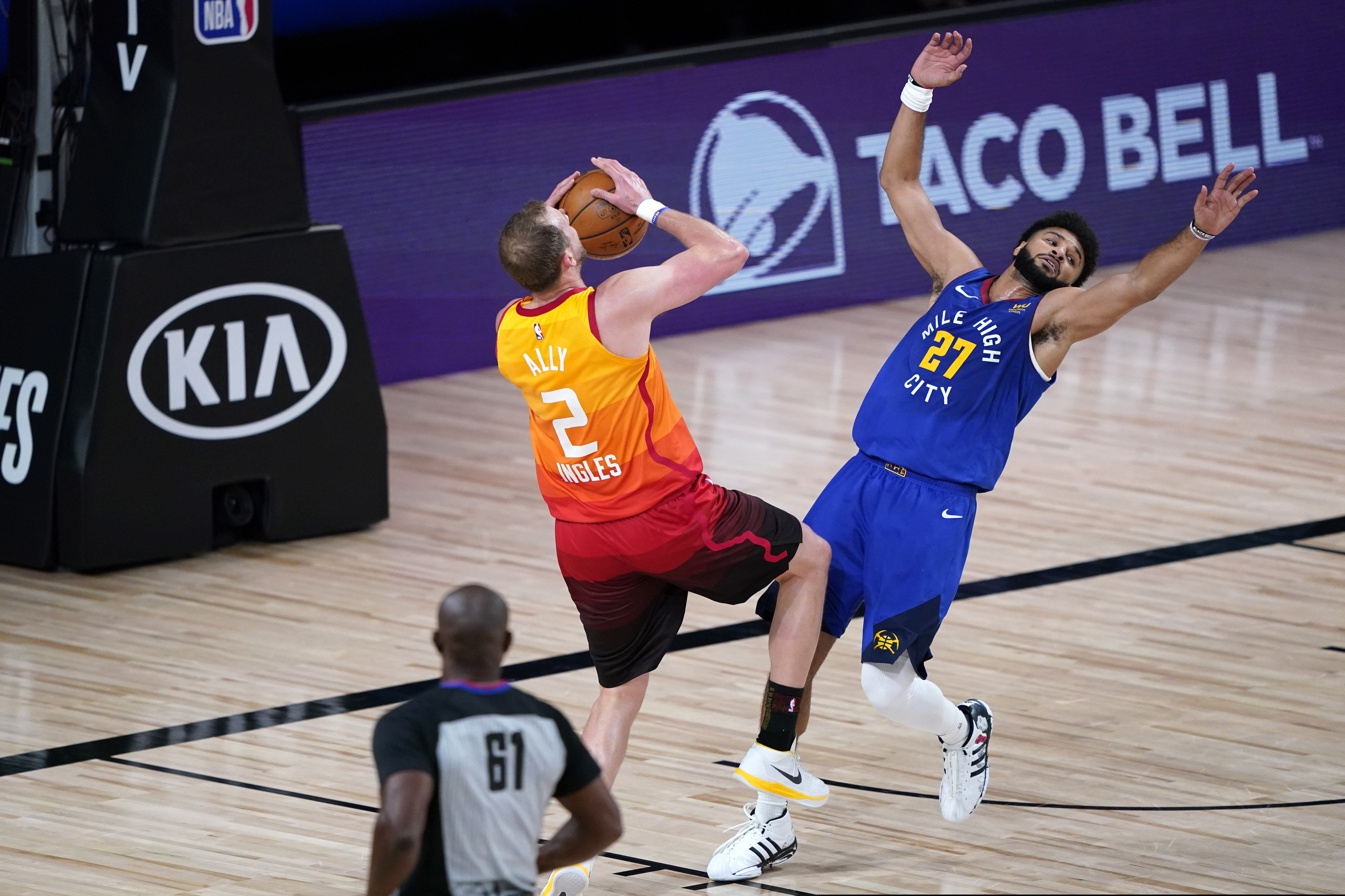 Utah Jazz's Joe Ingles (2) is fouled by Denver Nuggets' Jamal Murray (27) during the first half of an NBA basketball first round playoff game Sunday, Aug. 30, 2020, in Lake Buena Vista, Fla. (AP Photo/Ashley Landis)