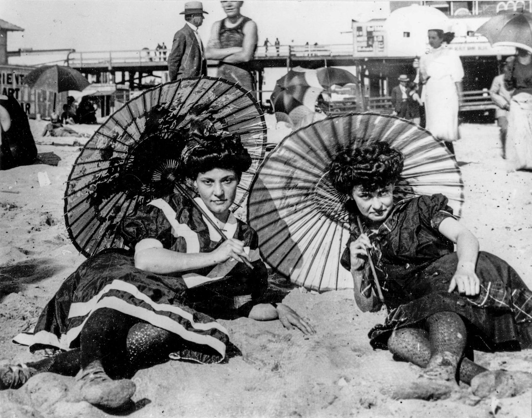 (Utah State Historical Society) Fashionable Saltair bathers pose for a photograph on the Great Salt Lake beach at Saltair I. Bathing costumes were made from wool, mohair and flannel until the introduction of nylon and other flexible fabrics in the 1930s.