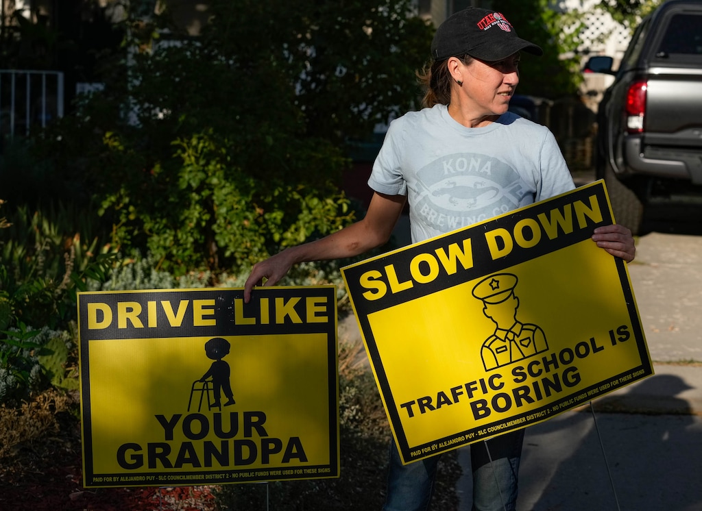 (Francisco Kjolseth | The Salt Lake Tribune) Marsha Merrill holds some of the signs she requested from Salt Lake City Council member Alejandro Puy, which he designed himself, so she could put them up in her neighborhood on the west side on Friday, July 22, 2022. Speeding is one of the main concerns of west-siders.