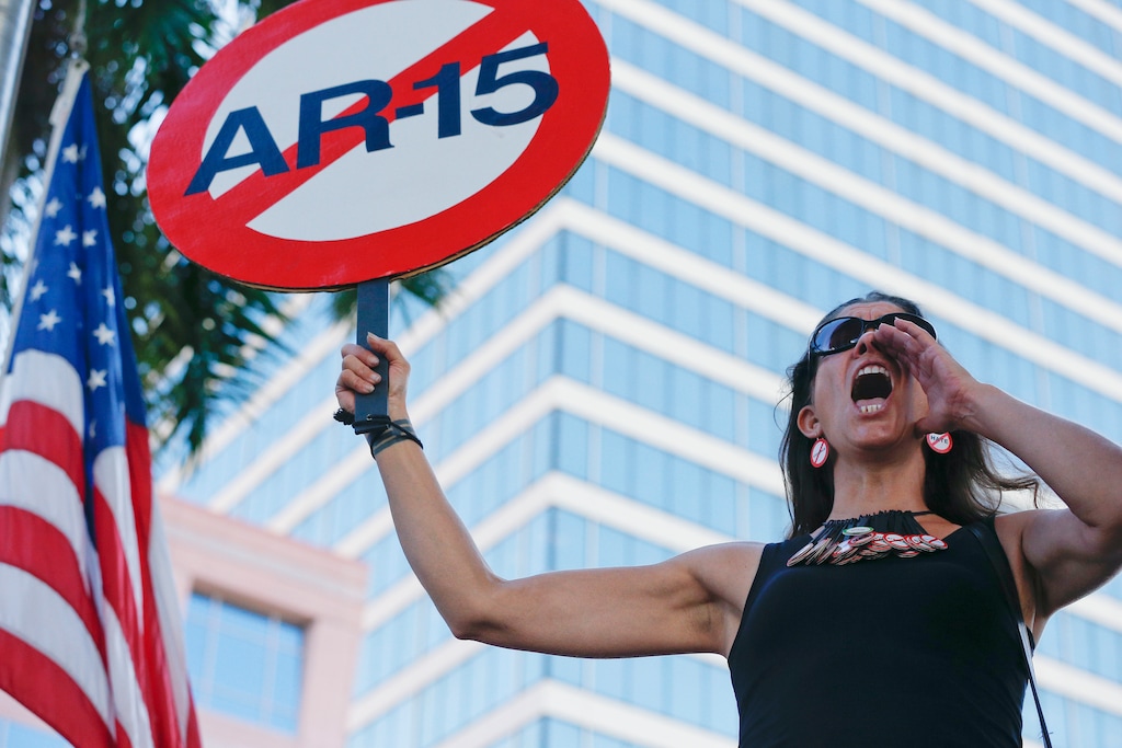 (Brynn Anderson | The Associated Press) Alessandra Mondolfi holds a sign against AR-15 weapons as she yells, "No More" during a protest against guns on the steps of the Broward County Federal courthouse in Fort Lauderdale, Fla., on Saturday, Feb. 17, 2018. Nikolas Cruz, a former student, is charged with killing 17 people at Marjory Stoneman Douglas High School in Parkland, Fla., on Wednesday.