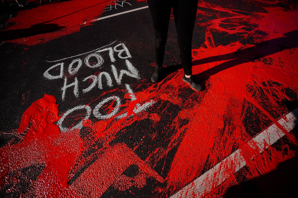(Trent Nelson  |  Tribune file photo) Protesters paint the street red in front of the Salt Lake County District Attorney’s office in Salt Lake City on Thursday, July 9, 2020.