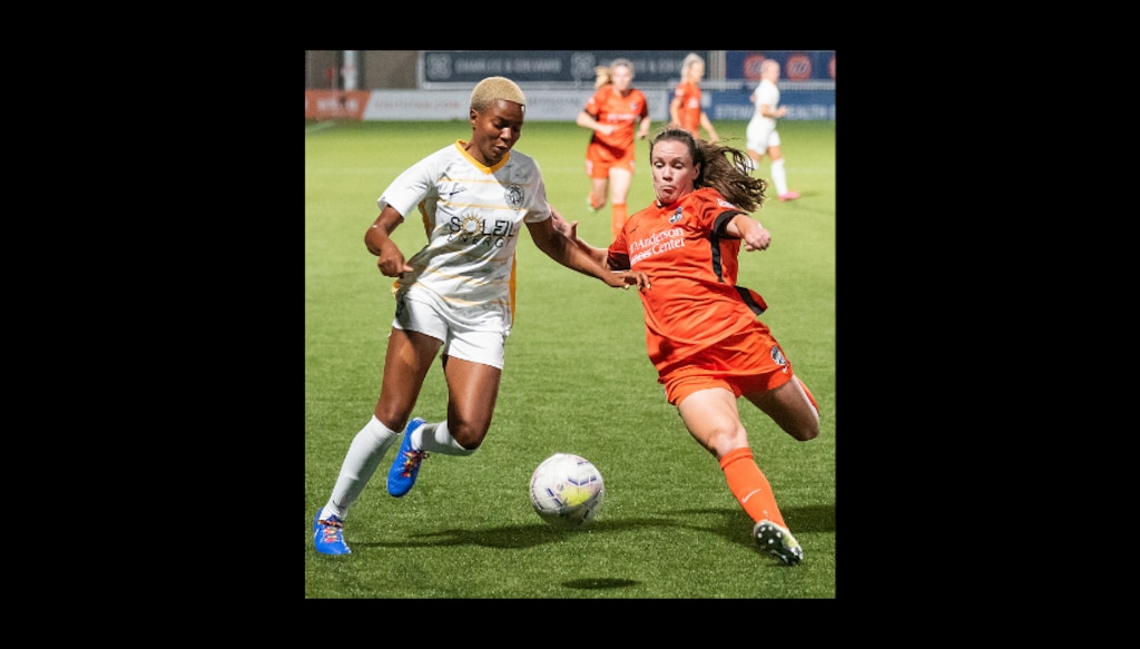 Michael Mangum | Special to the Tribune Houston Dash defender Allysha Chapman (2) slides to tackle Utah Royals FC forward Tziarra King (3) during their match at Zions Bank Stadium in Herriman, UT on Friday, July 17, 2020.