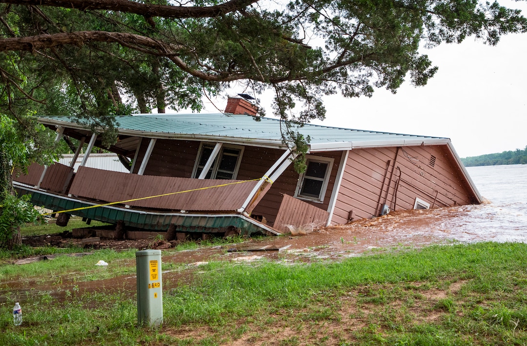 (Chris Landsberger/The Oklahoman via AP) Flood waters from the Cimarron River wash away a home in the Twin Lakes community near Cimarron City, Okla. on Wednesday, May 22, 2019.