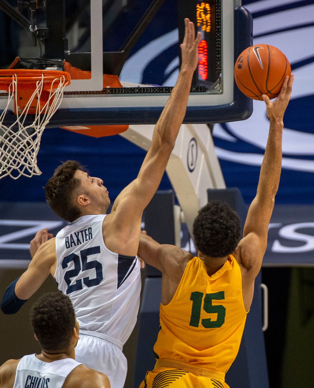 (Rick Egan  |  The Salt Lake Tribune)      San Francisco Dons forward Nate Renfro (15) shoots overBrigham Young Cougars forward Gavin Baxter (25), in WCC basketball action at the Marriott Center, Thursday, February 21, 2018.