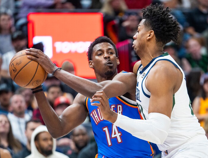 (Rick Egan | The Salt Lake Tribune)  Utah Jazz center Hassan Whiteside (21), guards Oklahoma City Thunder forward, Jaylen Hoard (14), in NBA action between the Utah Jazz and the Oklahoma City Thunder at Vivint Arena, on Wednesday, April 6, 2022.
