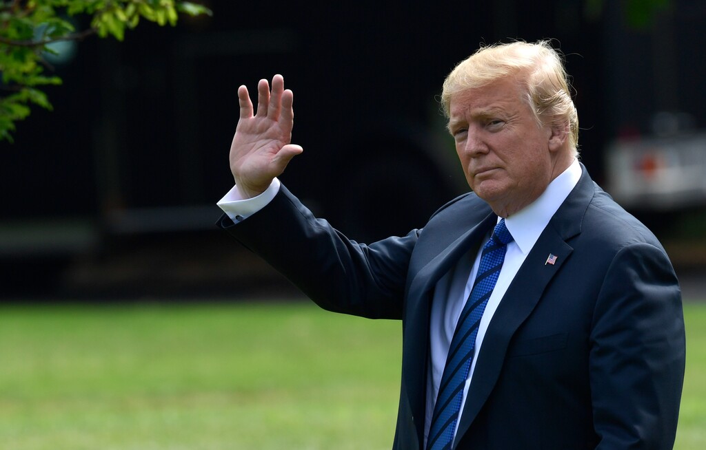 (Susan Walsh | The Associated Press) President Donald Trump waves as he walks across the South Lawn of the White House in Washington, Friday, July 20, 2018, to board Marine One for a short trip to Andrews Air Force Base, Md., en route to Bedminster N.J., for the weekend.