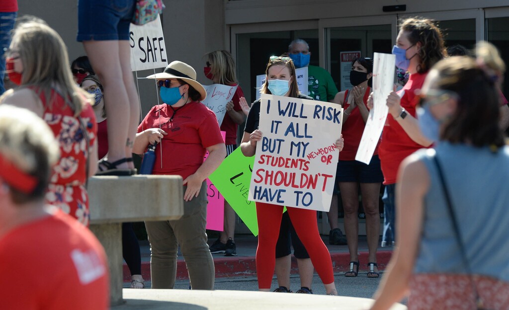 (Francisco Kjolseth  |  Tribune file photo) Hundreds of Granite School district teachers gather at the Granite School District office on Tuesday, August 4, 2020, to protest the district’s plans for reopening, which will allow students back into the classroom, like normal, five days a week.