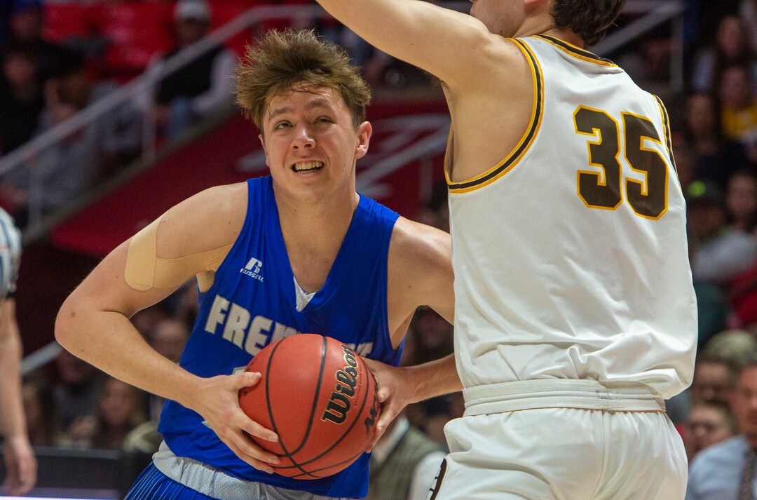 (Rick Egan  |  The Salt Lake Tribune)     Silverwolves Mitch Stratford (12) drives to the basket as Davis High forward Dylan Perrenoud (35)	defends, in the 6A championship game at the Jon M. Huntsman Center, Saturday Feb. 29, 2020