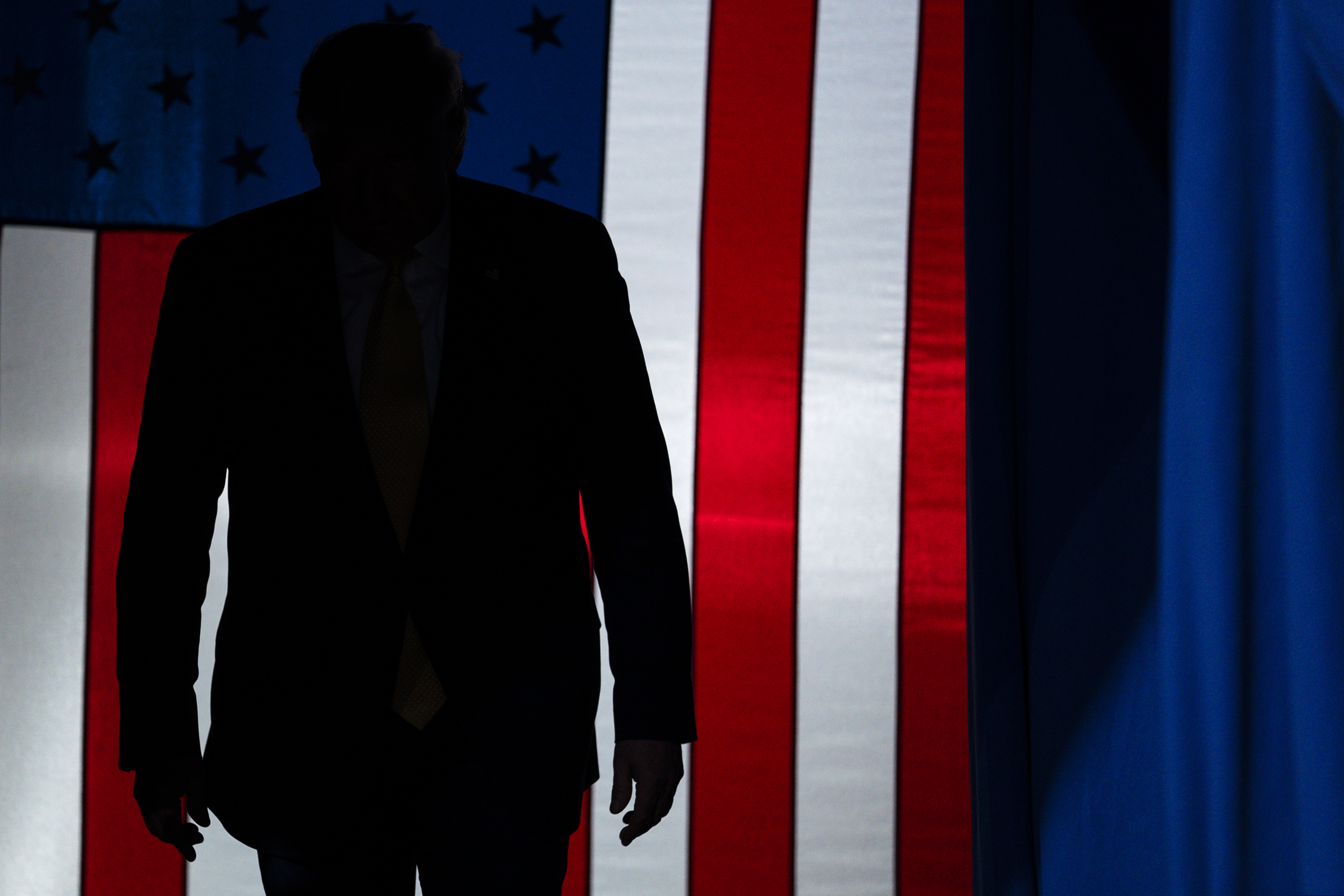 (Evan Vucci | AP file photo) In this Feb. 20, 2020, file photo President Donald Trump arrives to speak at a campaign rally at The Broadmoor World Arena in Colorado Springs, Colo. As the economy faces a once-in-a-century recession, with more than 38 million people out of work, Trump is increasingly talking up a future recovery that probably won't materialize until after the November election.