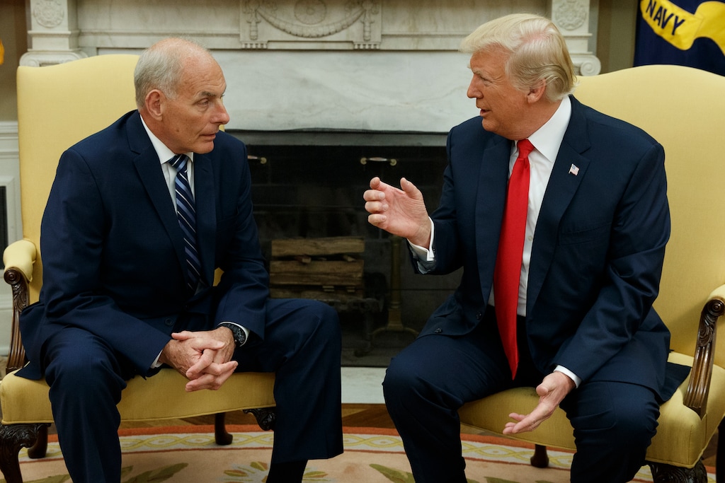 FILE - In this July 31, 2017, file photo, President Donald Trump talks with new White House Chief of Staff John Kelly after he was privately sworn in during a ceremony in the Oval Office in Washington. For an administration that has spent 2017 throwing off headlines at a stunningly dizzying pace, the frenetic fortnight in the second half of July reached an unparalleled breakneck speed. Set amid the backdrop of a president grappling with his deepest insecurities, the West Wing’s breakdown in policy collided with its collapse in personnel and acted as a crucial inflection point for Trump’s first year in office. (AP Photo/Evan Vucci, File)