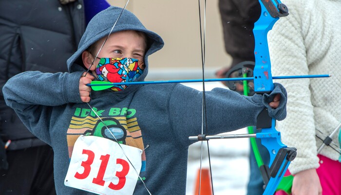 (Rick Egan | The Salt Lake Tribune) Tristan Madiske, 8, competes in the archery competition, during the 36th annual Bryce Canyon Winter Festival on Sunday, Feb. 14, 2021.