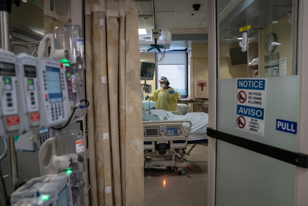 (Erin Schaff | The New York Times) A nurse checks on a COVID-19 patient at Houston Methodist Hospital in Houston, July 5, 2020. The Trump administration recently ordered hospitals to stop sending coronavirus patient data to the Centers for Disease Control and Prevention.