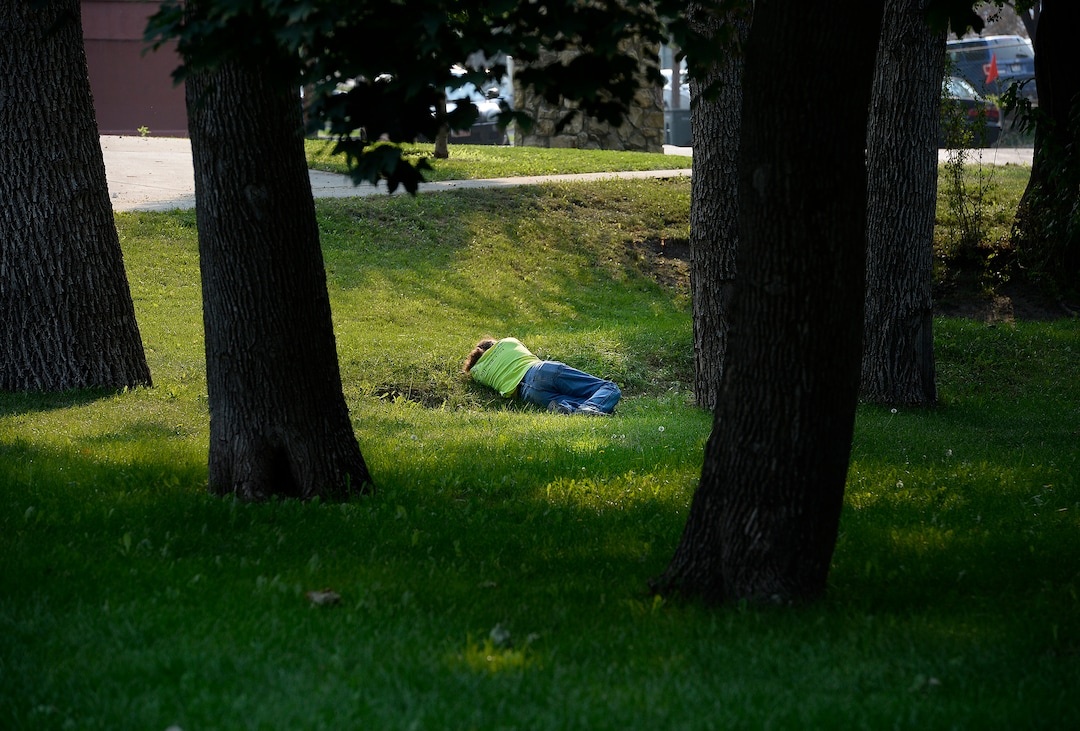 (Scott Sommerdorf   |  The Salt Lake Tribune)   A man lays alone on the grass in Fairmont Park, Wednesday, September 6, 2017.