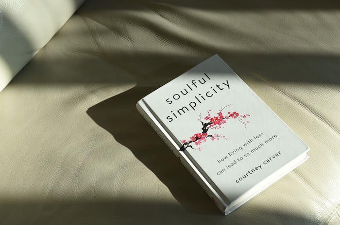 (Francisco Kjolseth  |  The Salt Lake Tribune)  National blogger Courtney Carver has made a living out of simplifying her life and has a new book "Soulful Simplicity." It started a few years ago when she started a minimalist fashion challenge on her blog called Project 333, dressing with just 33 items or less for 3 months. The project went viral and for her it has extended beyond the closet, by also taking control of her health and expenses. Along with her husband and their two cats they share a 900-square-foot living space in Salt Lake and have decided not to rush into decorating the walls or the apartment.