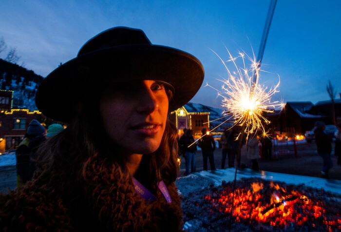 (Rick Egan  |  The Salt Lake Tribune)     Verena Puhm, a director and writer from  from Los Angeles plays with a sparkler at the first-ever Sundance  bonfire, a community gathering on Swede Alley, in Park City, Thursday, Jan. 30, 2020.