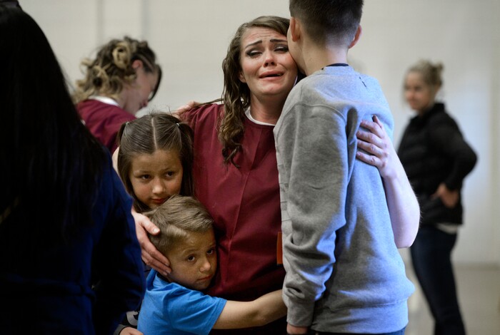 (Scott Sommerdorf   |  The Salt Lake Tribune)   Inmate Dianna Robles says goodbye to her children Brooklyn, left, Cameron, center, and Demitrie, right, at the end of "Kids Day" at the Utah State Prison, Saturday, October 7, 2017.