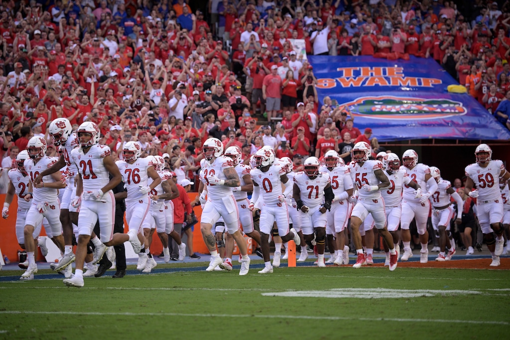 (Phelan M. Ebenhack | AP) Utah players run onto the field before an NCAA college football game against Florida, Saturday, Sept. 3, 2022, in Gainesville, Fla.