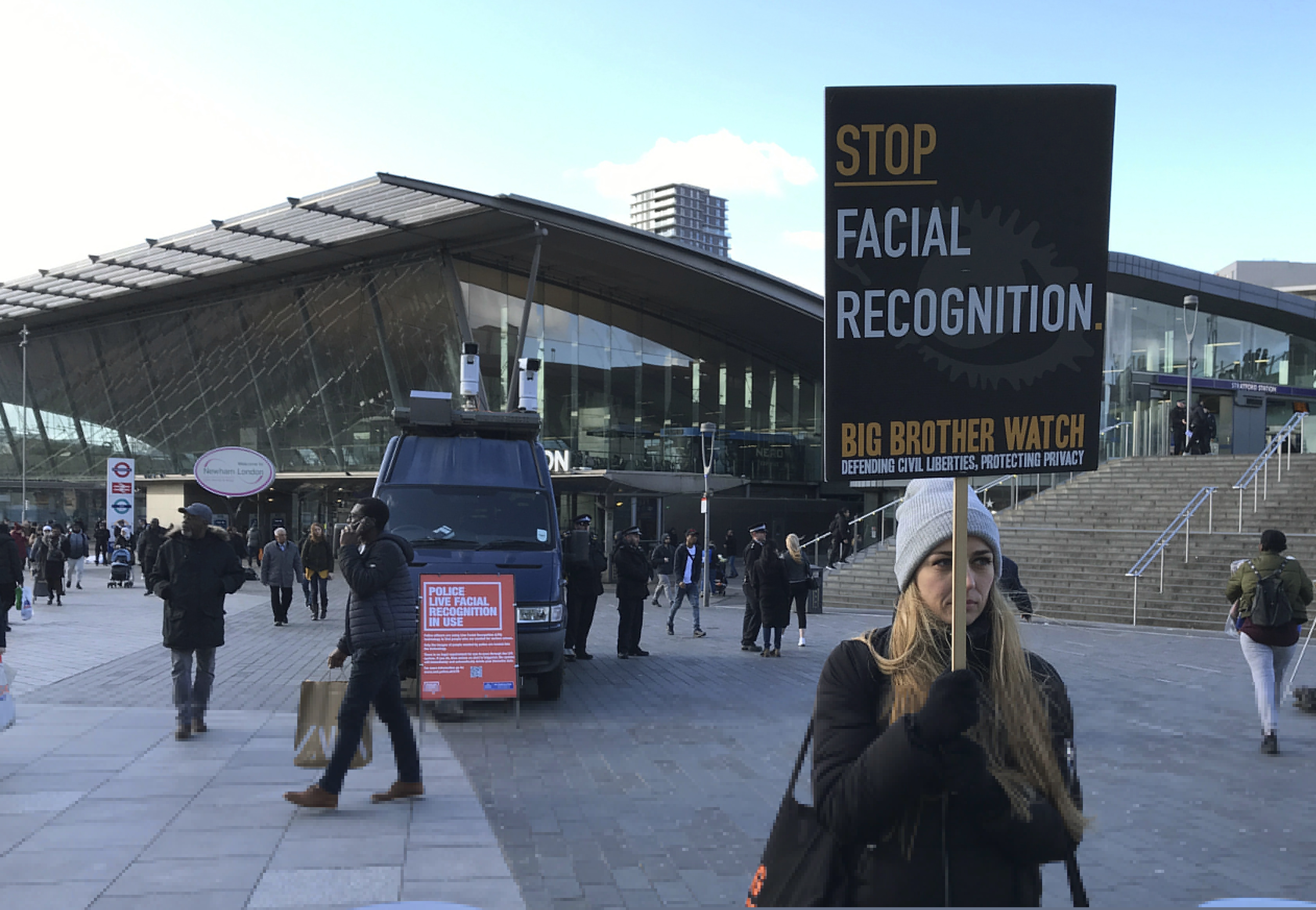 (Kelvin Chan | AP)  Rights campaigner Silkie Carlo demonstrates in front of a mobile police facial recognition facility outside a shopping centre in London Tuesday Feb. 11, 2020, "We don't accept this. This isn't what you do in a democracy," said Carlo, director of privacy campaign group Big Brother Watch. London police started using facial recognition surveillance cameras mounted on a blue police van on Tuesday to automatically scan for wanted people, as authorities adopt the controversial technology that has raised concerns about increased surveillance and erosion of privacy.