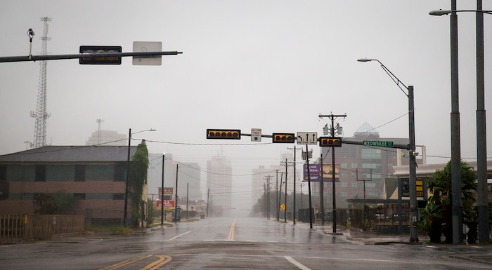 (Nick Wagner | Austin American-Statesman via AP) A street sits empty as Hurricane Harvey makes landfall in Corpus Christi, Texas, on Friday, Aug. 25, 2017. Hurricane Harvey smashed into Texas late Friday, lashing a wide swath of the Gulf Coast with strong winds and torrential rain from the fiercest hurricane to hit the U.S. in more than a decade.