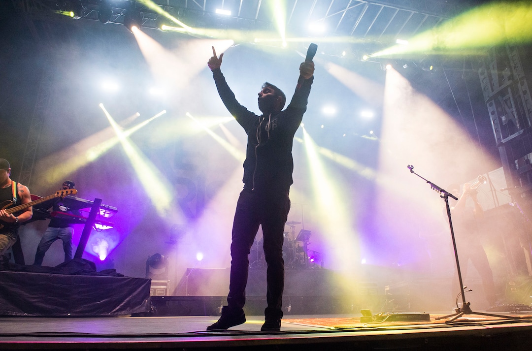 (Rick Egan  |  The Salt Lake Tribune)   Eric Rachmany get the crowd going as he performs with Rebellion, at the Regge Rise Up Music Festival at the Rivers Edge near Heber City, Friday, Aug. 23, 2019.