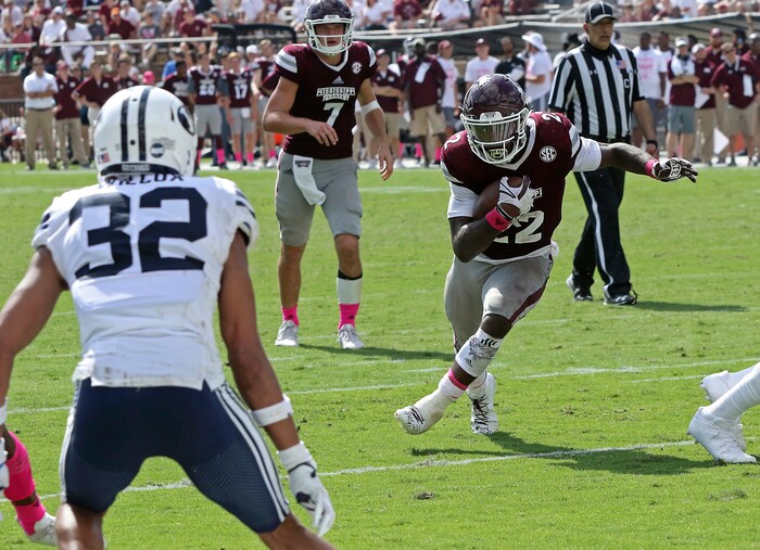 Mississippi State running back Aeris Williams (22) finds running room into the end zone and pat BYU defensive back Chris Wilcox (32) during the second half of an NCAA college football game in Starkville, Miss., Saturday, Oct. 14, 2017. Mississippi State won 35-10. (AP Photo/Jim Lytle)