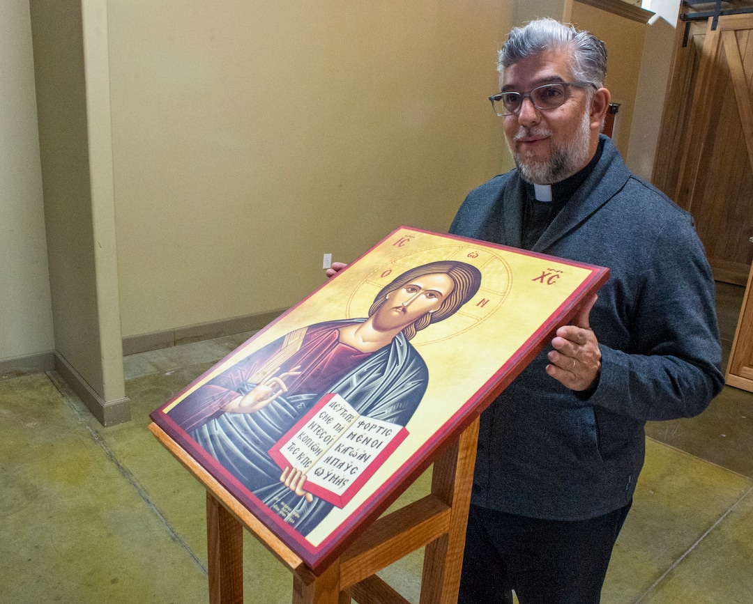 (Rick Egan  |  The Salt Lake Tribune)    The Rev. Anthony Savas, pastor holds one of the icons, in the new St. Anna Orthodox Church in Sandy, Friday, Jan. 24, 2020.