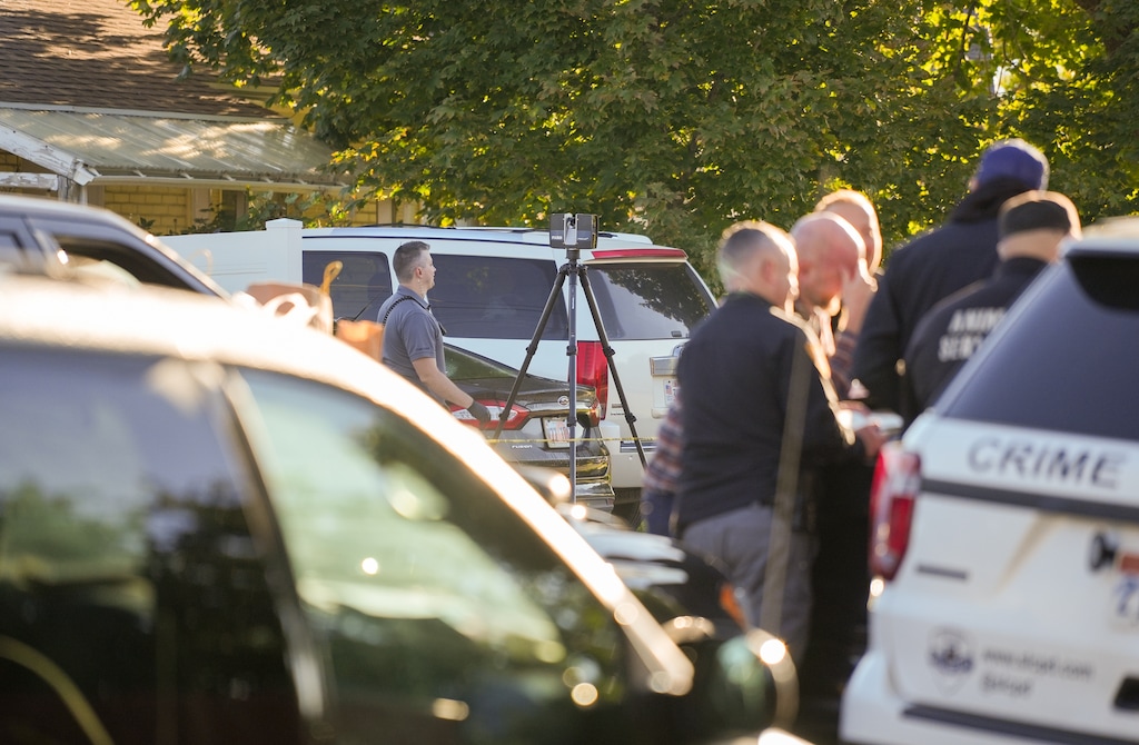 (Chris Samuels | The Salt Lake Tribune) Law enforcement conduct an investigation after police shot and killed a man outside his home in Taylorsville, Thursday, Oct. 5, 2023.