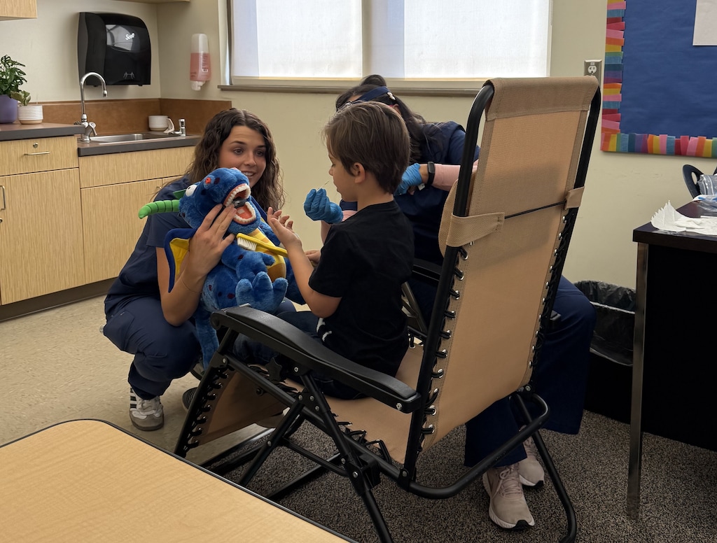 (BYU faculty) A student receives a dental assessment through a school-based oral health program at Helen M. Knight Elementary School in October 2025. Since the program began in March 2024, students have received 1,237 visual dental assessments, with about 41% identifying oral-health concerns requiring timely treatment.