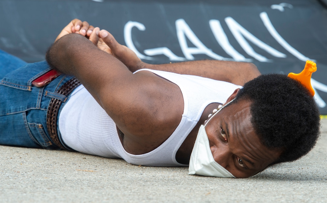 (Rick Egan  |  The Salt Lake Tribune) Joshua Straudher lies down for 8 minutes and 46 seconds in memory of George Floyd during a demonstration at Washington Square in Salt Lake City on Saturday, June 20, 2020.