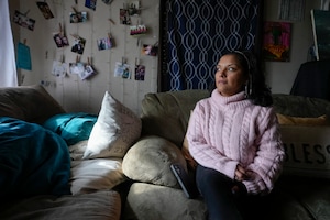 (Bethany Baker | The Salt Lake Tribune) Flor Isabel, a parent of four who has asthma, sits in their living room at home in Kearns on Wednesday, Dec. 20, 2023.