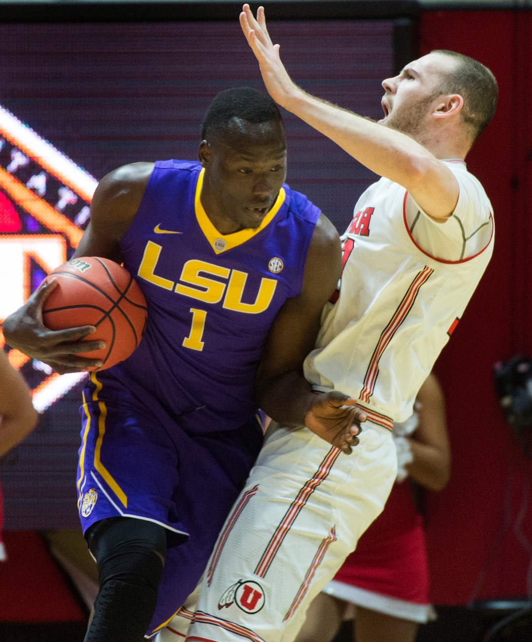 (Rick Egan  |  The Salt Lake Tribune)    LSU Tigers forward Duop Reath (1) collides with Utah Utes forward David Collette (13), in NIT playoff action between Utah Utes and LSU Tigers at the Jon M. Huntsman Center, Monday, March 19, 2018.