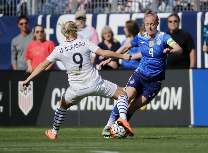 United States' defender Becky Sauerbrunn (4) plays against France's forward Eugenie Le Sommer (9) during the first half of a SheBelieves Cup women's soccer match Sunday, March 6, 2016, in Nashville, Tenn. (AP Photo/Mark Humphrey)